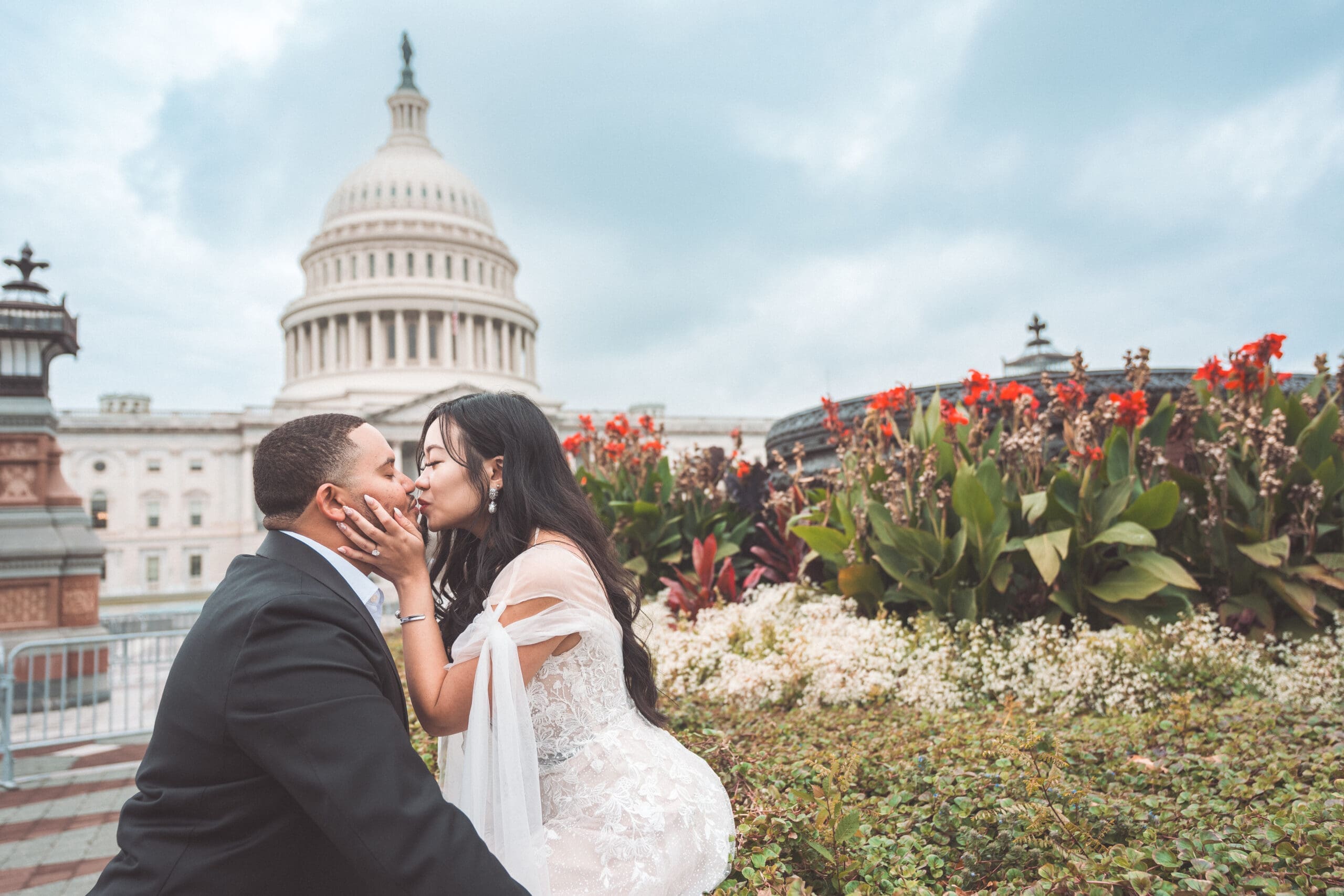 Couple sharing an intimate moment in front of the U.S. Capitol during a romantic Washington DC engagement session