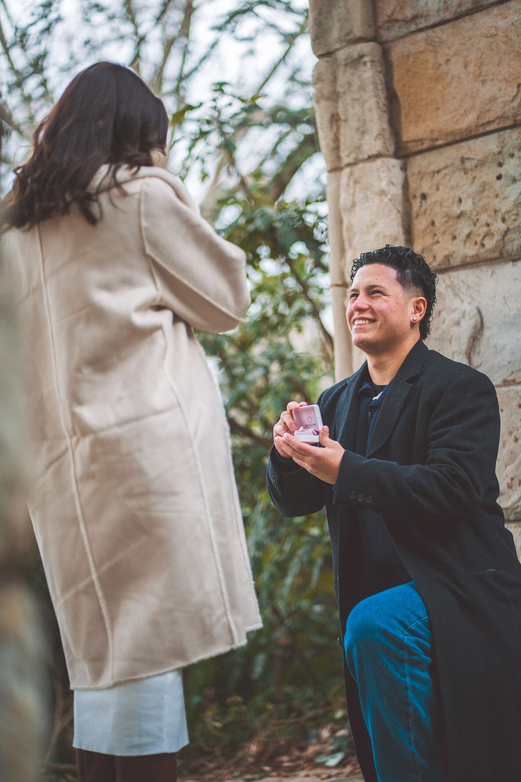 Emotional reaction during a Washington DC proposal as the groom-to-be presents the engagement ring.