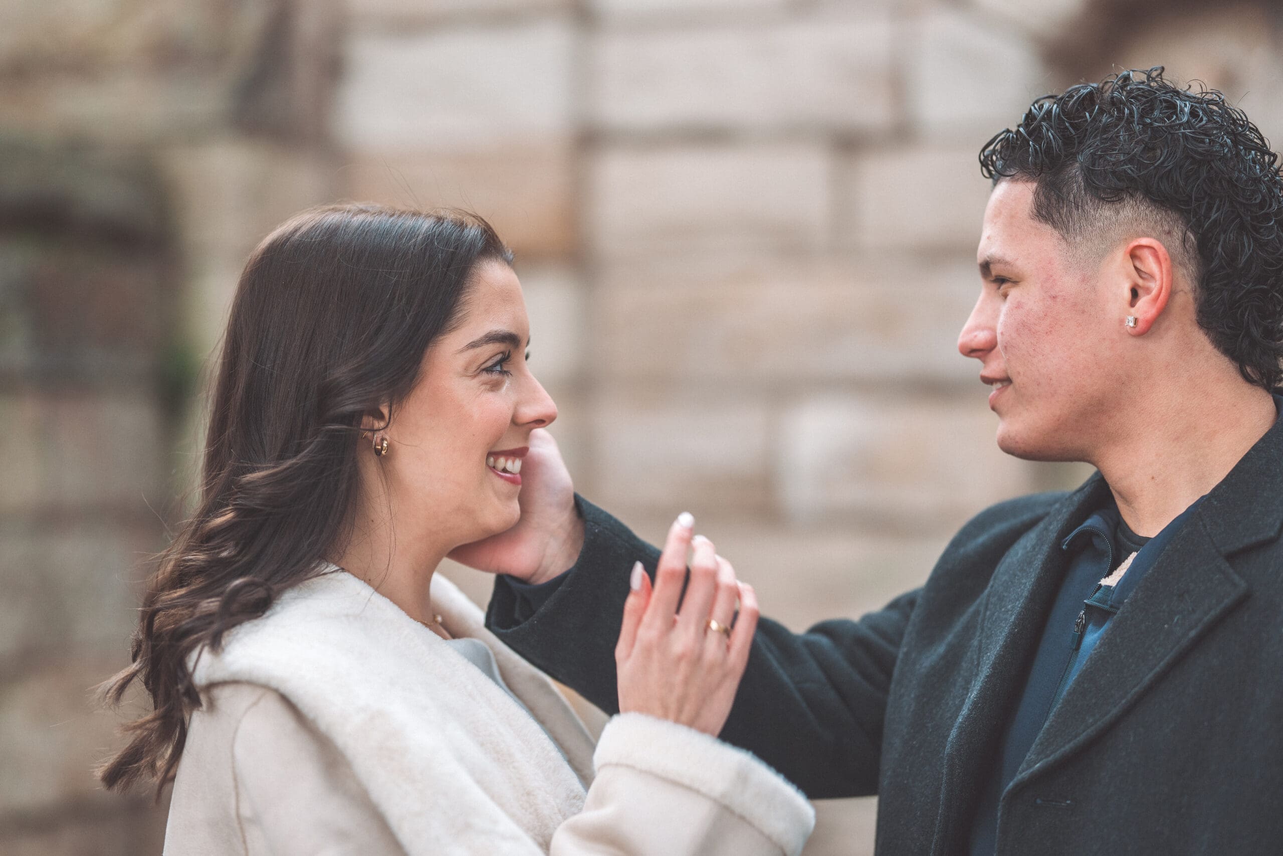 Close-up portrait of a newly engaged couple smiling together after their Washington DC proposal.
