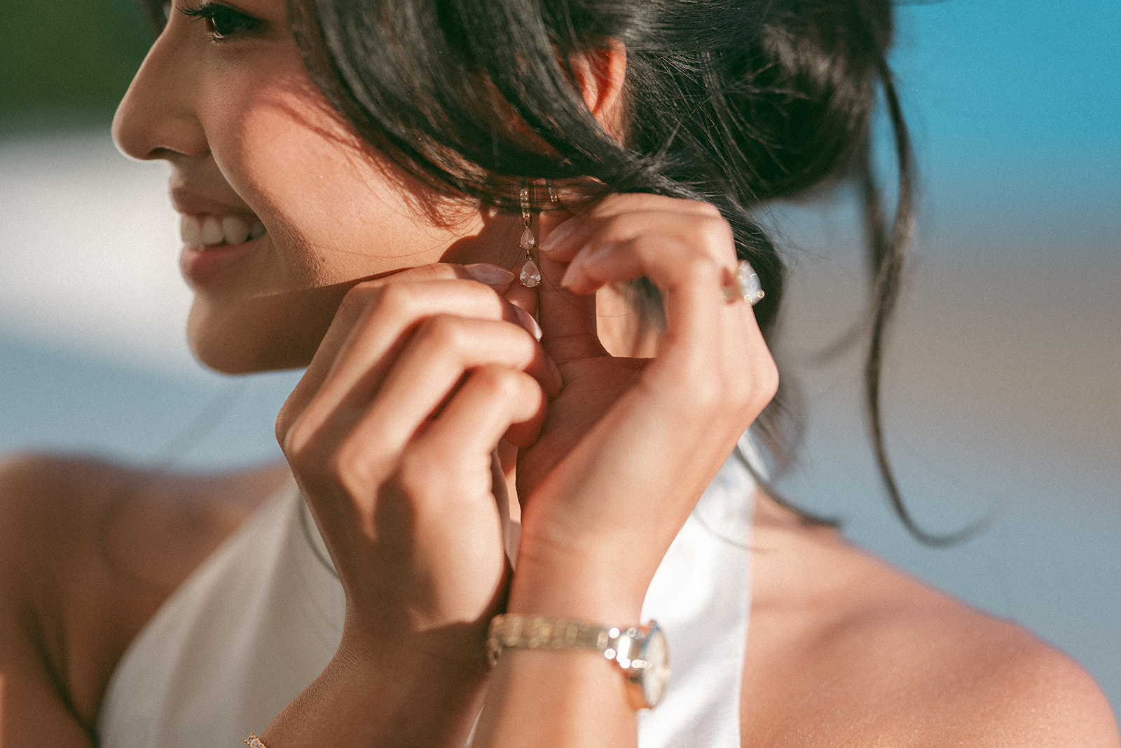 Bride adjusting her earring before a Washington DC engagement session.