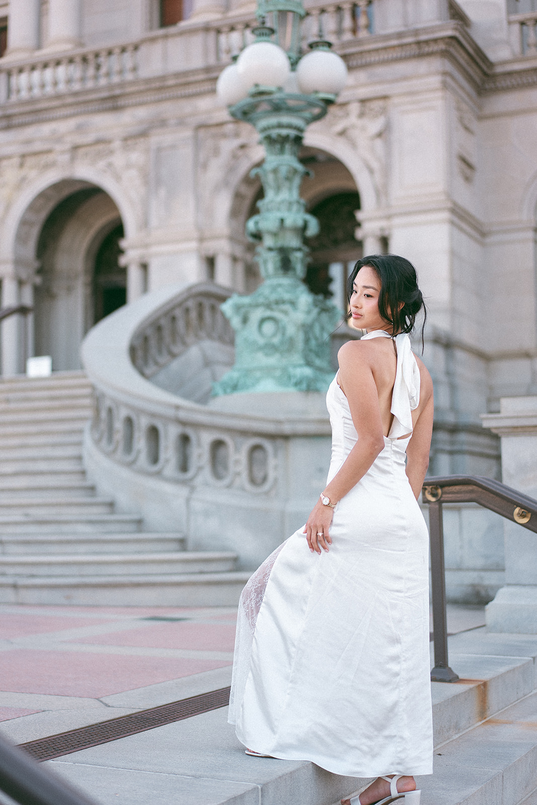 Bridal portrait outside the Library of Congress with historic architecture in the background.
