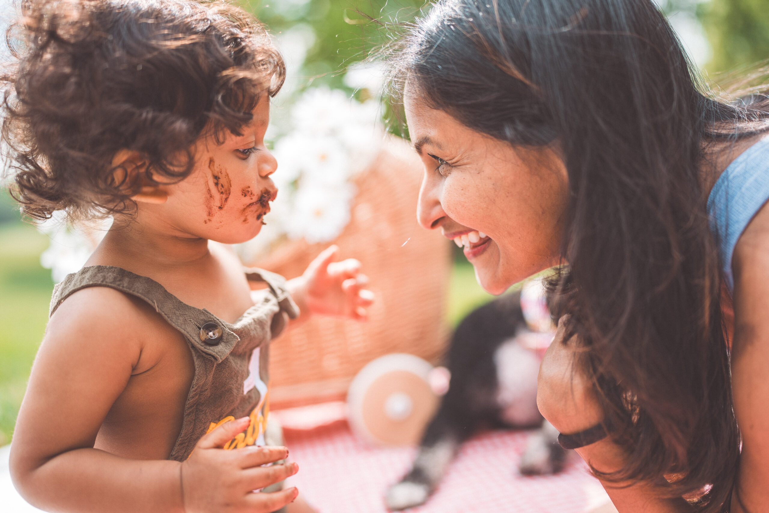 Mother sharing a sweet, nose-to-nose moment with her toddler during a Maryland family photoshoot.