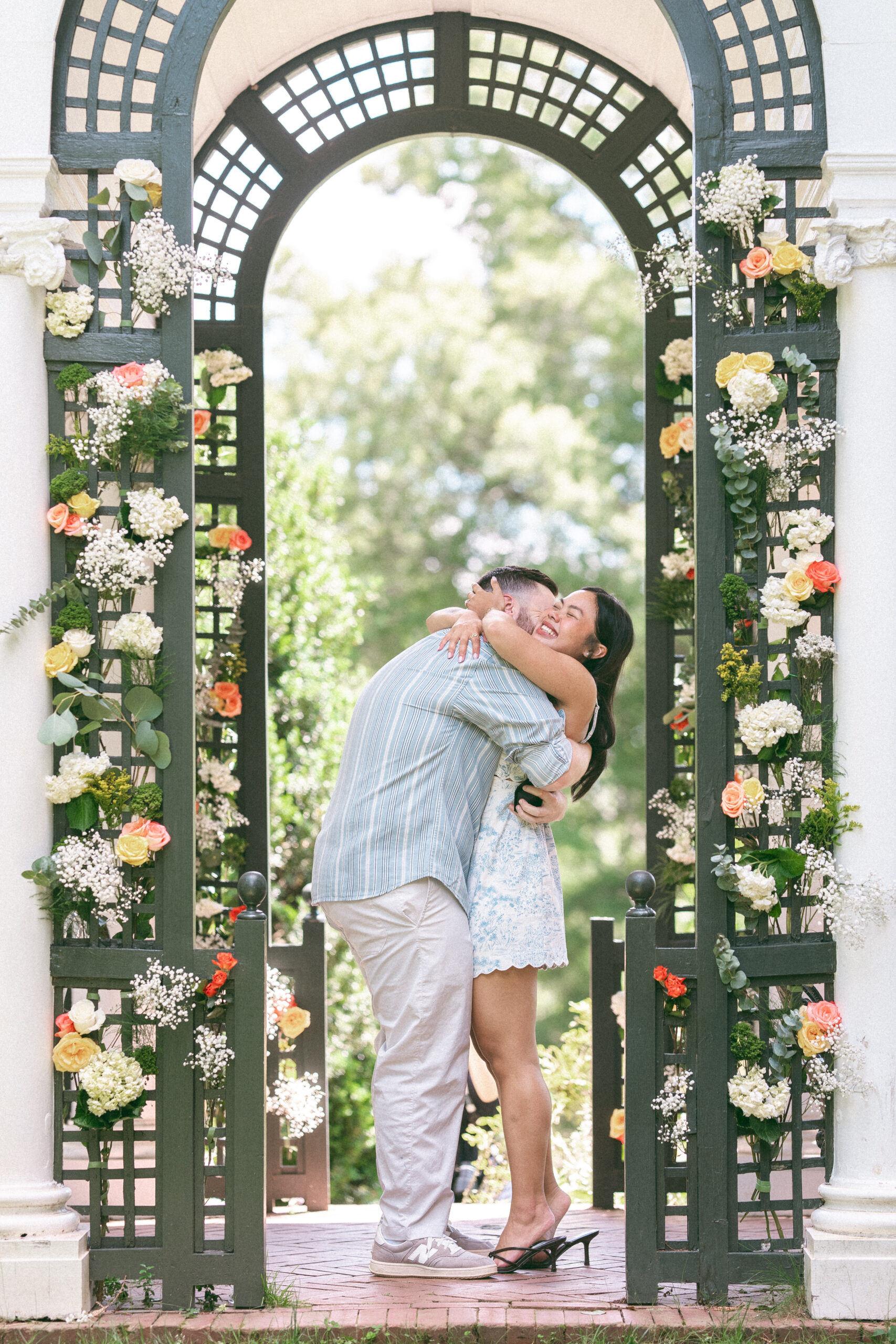 Couple embracing after a successful Northern Virginia proposal.