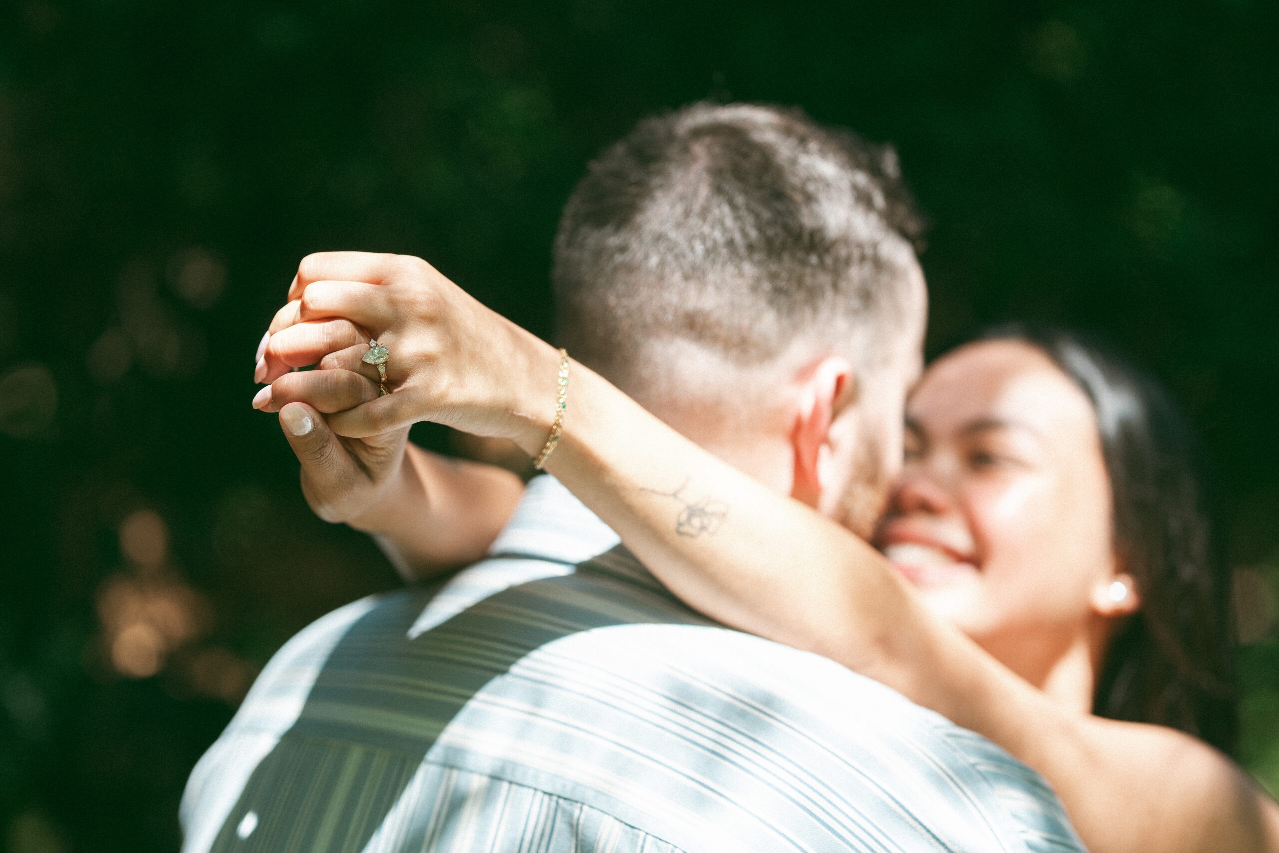 Close-up of an engagement ring during a Northern Virginia proposal celebration.