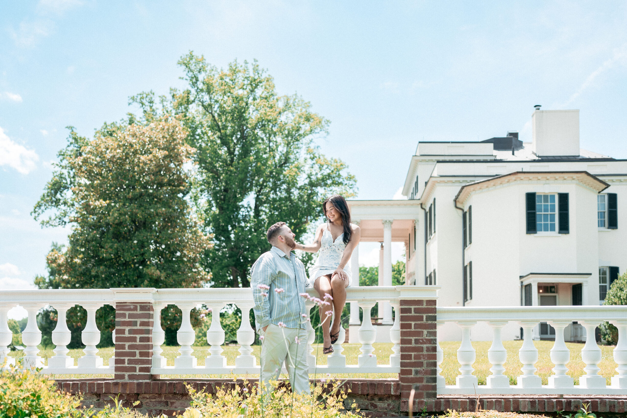 Newly engaged couple together outside a historic estate following their Northern Virginia proposal.