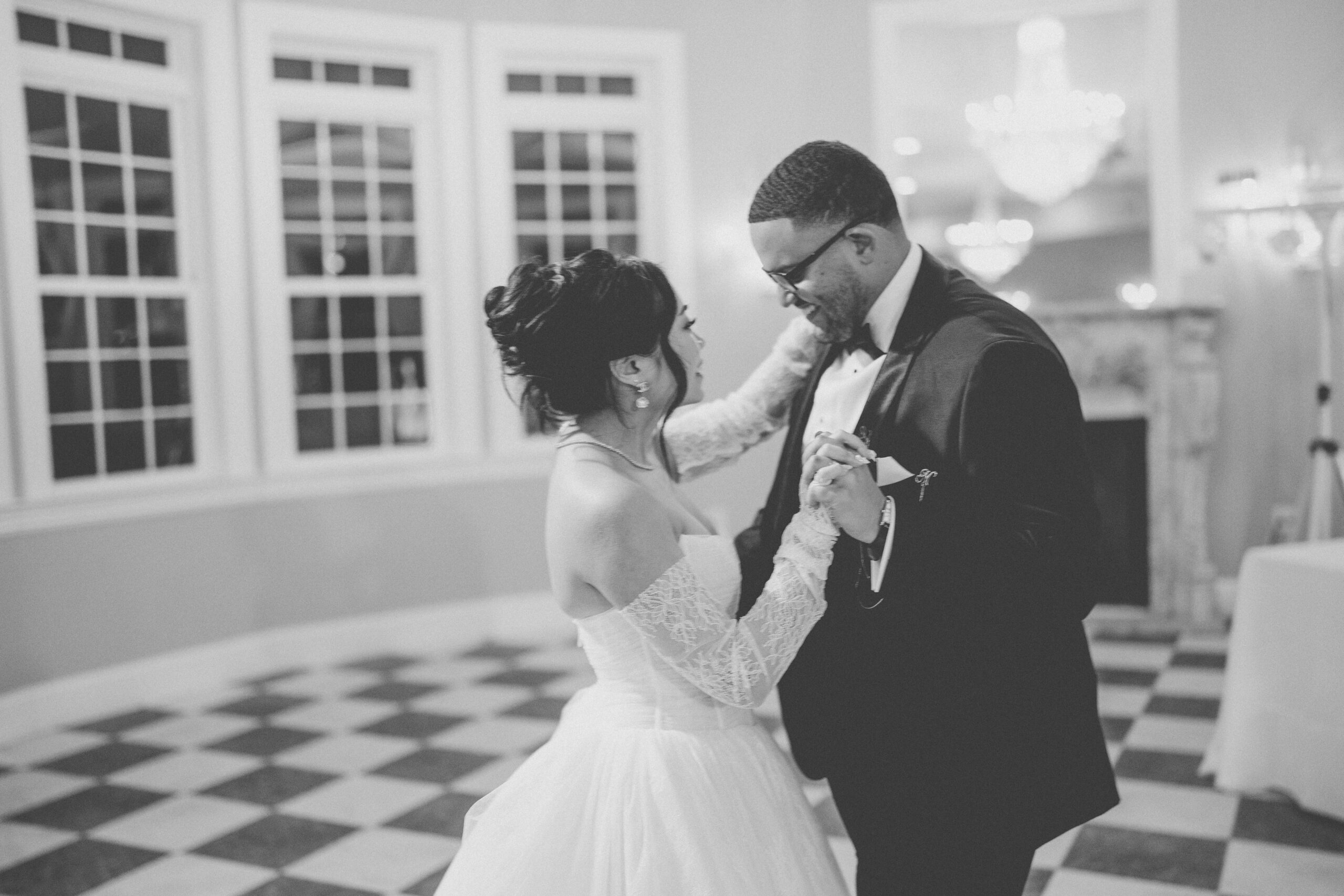 Black-and-white photo of the bride and groom sharing a dance together during their Cameron Estate Inn reception.