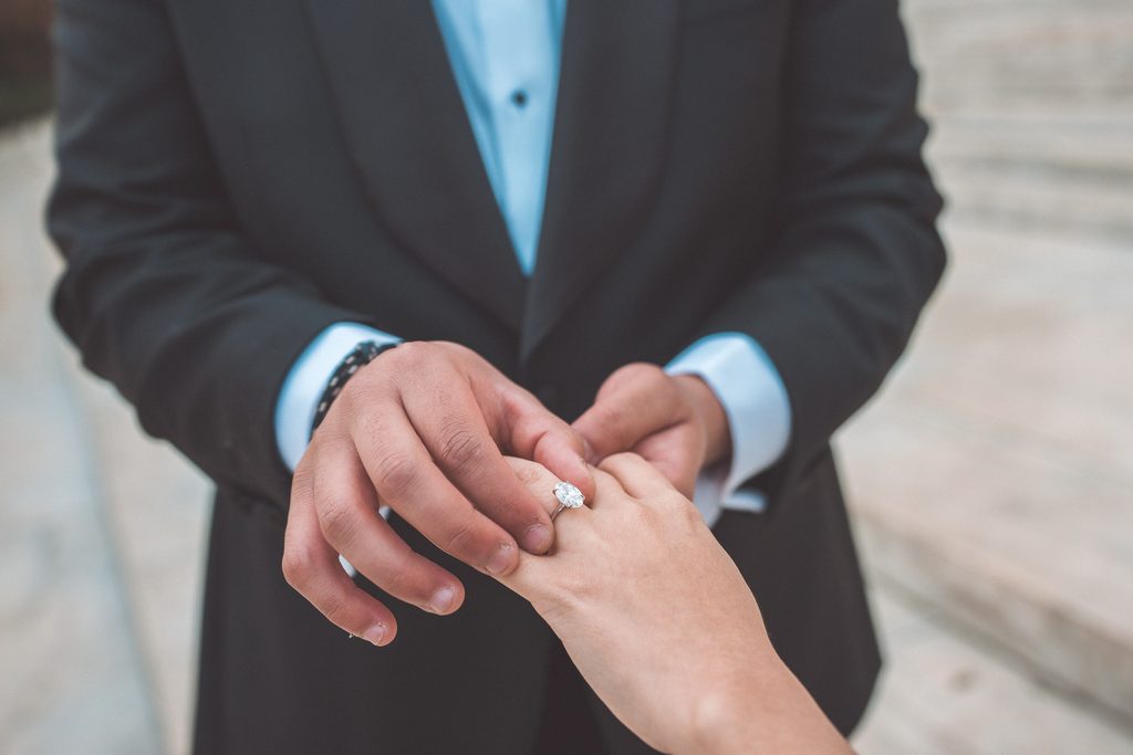 Close-up of an engagement ring on the bride-to-be’s hand during Jefferson Memorial engagement photos in Washington DC.