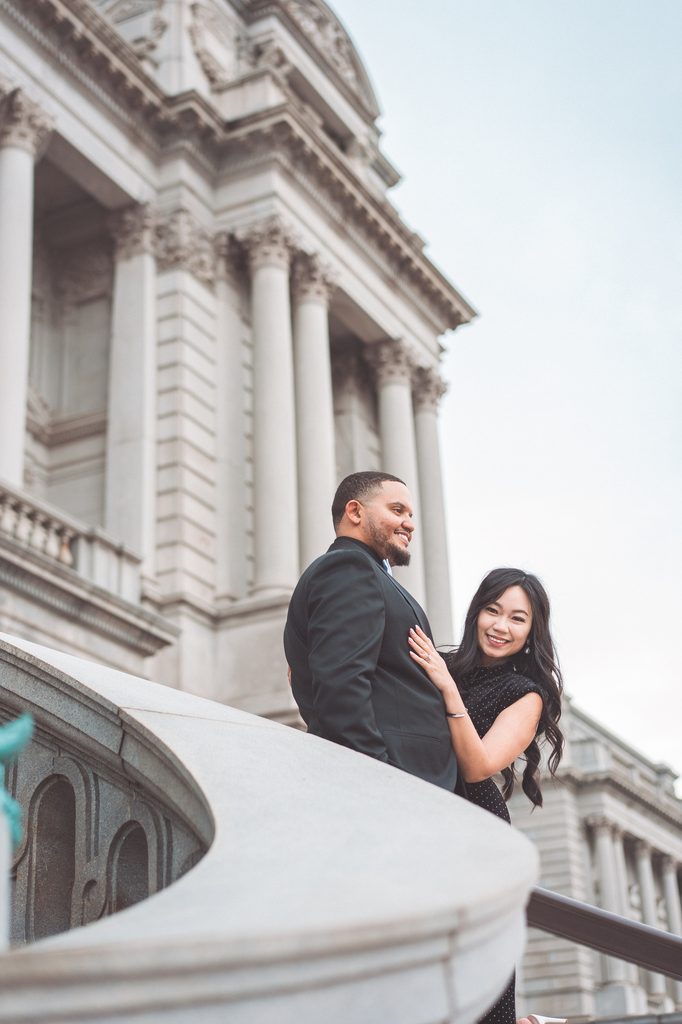 Couple smiling together on the steps of the Library of Congress during their Washington DC engagement session.